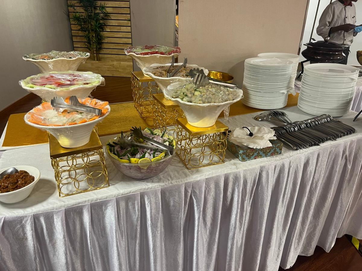 Tiered vegetarian salad presentation at a Bengaluru corporate luncheon